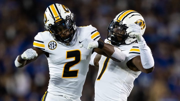 Sep 11, 2021; Lexington, Kentucky, USA; Missouri Tigers defensive back Ennis Rakestraw Jr. (2) and defensive back Jaylon Carlies celebrate an interception at the beginning of the second quarter against the Kentucky Wildcats at Kroger Field. Mandatory Credit: Jordan Prather-USA TODAY Sports