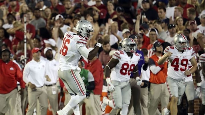 Sep 17, 2016; Norman, OK, USA; Ohio State Buckeyes quarterback J.T. Barrett (16) celebrates throwing a touchdown pass during the first half against the Oklahoma Sooners at Gaylord Family - Oklahoma Memorial Stadium. Mandatory Credit: Kevin Jairaj-USA TODAY Sports