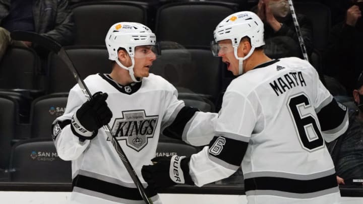 Apr 30, 2021; Anaheim, California, USA; Los Angeles Kings center Lias Andersson (24) celebrates with defenseman Olli Maatta (6) his goal scored against the Anaheim Ducks during the third period at Honda Center. Mandatory Credit: Gary A. Vasquez-USA TODAY Sports