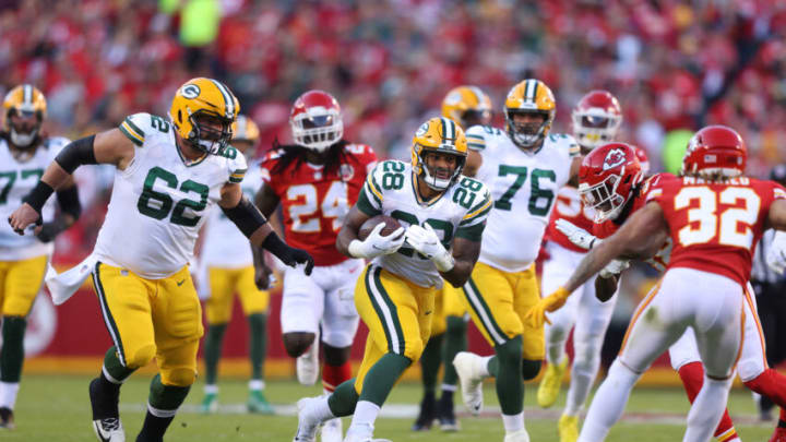 KANSAS CITY, MISSOURI - NOVEMBER 07: A.J. Dillon #28 of the Green Bay Packers runs the ball during the first quarter in the game against the Kansas City Chiefs at Arrowhead Stadium on November 07, 2021 in Kansas City, Missouri. (Photo by Jamie Squire/Getty Images)