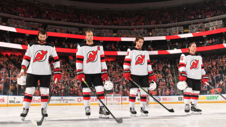 EDMONTON, AB - NOVEMBER 8: Kyle Palmieri #21, Taylor Hall #9, Nico Hischier #13, and Sami Vatanen #45 of the New Jersey Devils stand for the singing of the national anthem prior to the game against the Edmonton Oilers on November 8, 2019, at Rogers Place in Edmonton, Alberta, Canada. (Photo by Andy Devlin/NHLI via Getty Images)