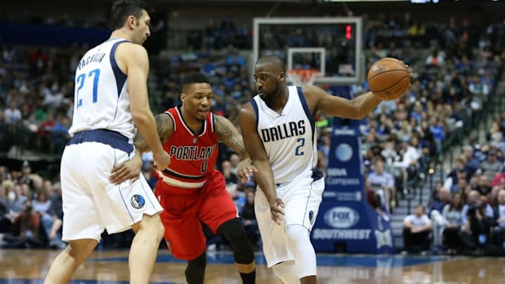 Mar 20, 2016; Dallas, TX, USA; Dallas Mavericks guard Raymond Felton (2) drives off a pick set by center Zaza Pachulia (27) against Portland Trail Blazers guard Damian Lillard (0) in the first quarter at American Airlines Center. Mandatory Credit: Matthew Emmons-USA TODAY Sports