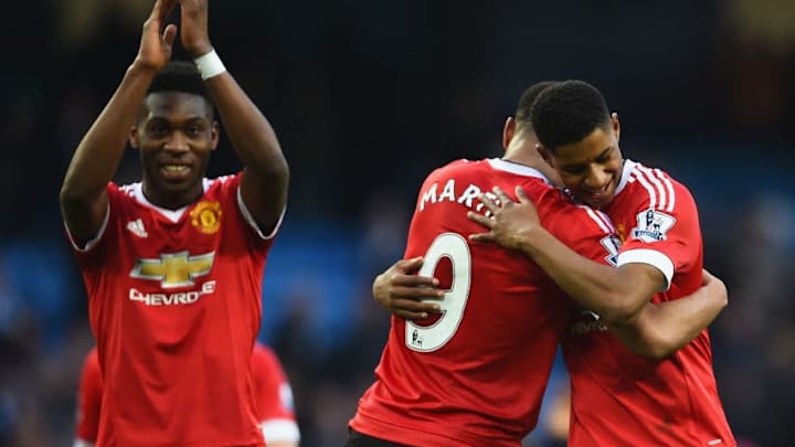 MANCHESTER, ENGLAND - MARCH 20: Winning goalscorer Marcus Rashford of Manchester United (R) and team mates Anthony Martial (C) and Timothy Fosu-Mensah celebrate victory after the Barclays Premier League match between Manchester City and Manchester United at Etihad Stadium on March 20, 2016 in Manchester, United Kingdom. (Photo by Laurence Griffiths/Getty Images)