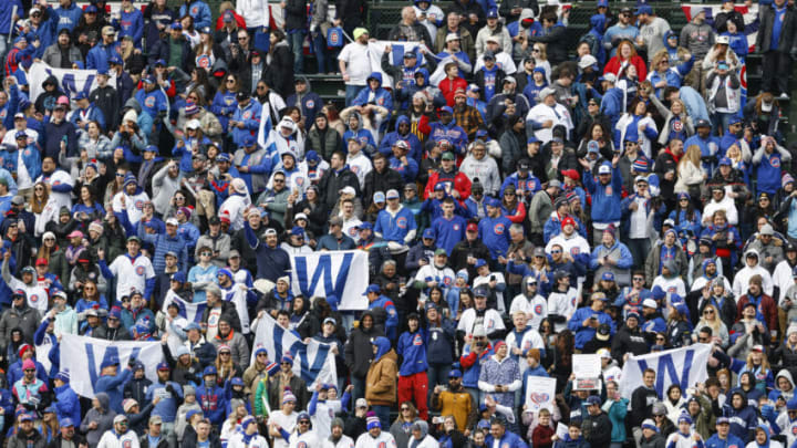 Mar 30, 2023; Chicago, Illinois, USA; Chicago Cubs fans celebrate their team win against the Milwaukee Brewers at Wrigley Field. Mandatory Credit: Kamil Krzaczynski-USA TODAY Sports