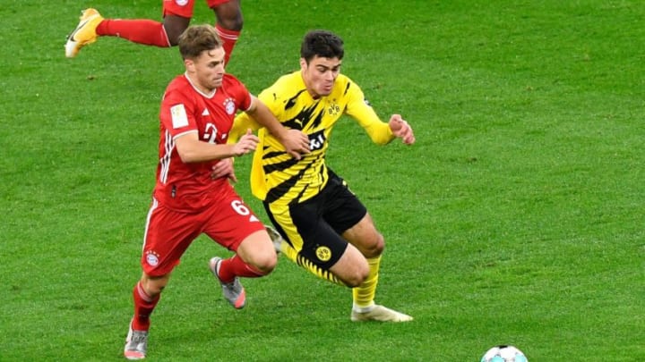 Bayern Munich midfielder Joshua Kimmich in action against Borussia Dortmund. (Photo by MARTIN MEISSNER/POOL/AFP via Getty Images)