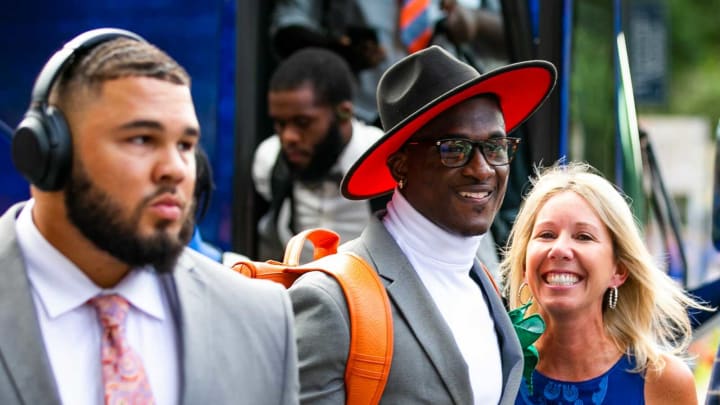 Florida Gators safety Trey Dean III (0) gets hug Megan Mullen as the Florida Gators arrived for Gator Walk as they were greeted by fans before playing the Tennessee Volunteers Saturday September 25, 2021 at Ben Hill Griffin Stadium in Gainesville, FL. [Doug Engle/GainesvilleSun]2021Flgai 092521 Gatorsvsvolsgatorwalk