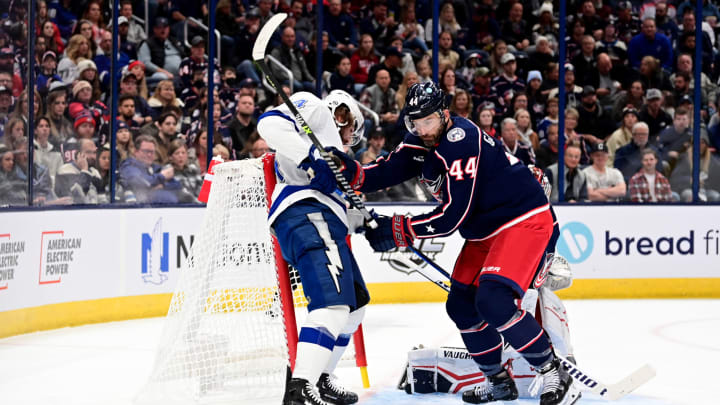 COLUMBUS, OHIO – OCTOBER 14: Erik Gudbranson #44 of the Columbus Blue Jackets and Pat Maroon #14 of the Tampa Bay Lightning compete for the puck during the first period at Nationwide Arena on October 14, 2022 in Columbus, Ohio. (Photo by Emilee Chinn/Getty Images)