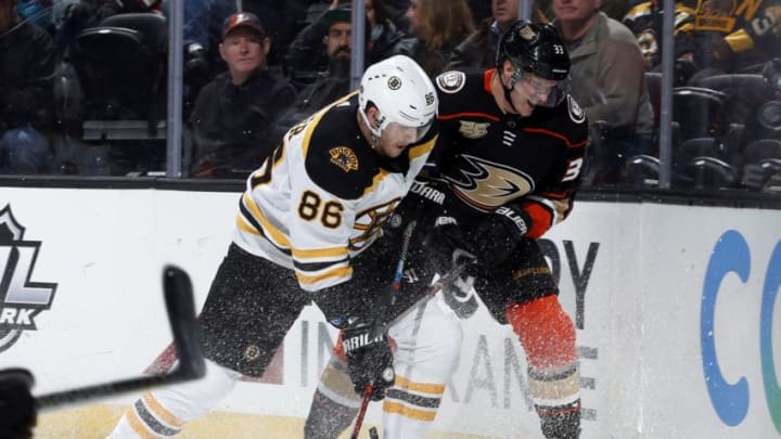 ANAHEIM, CA - FEBRUARY 15: Kevan Miller #86 of the Boston Bruins battles for the puck against Jakob Silfverberg #33 of the Anaheim Ducks during the game on February 15, 2019 at Honda Center in Anaheim, California. (Photo by Debora Robinson/NHLI via Getty Images)