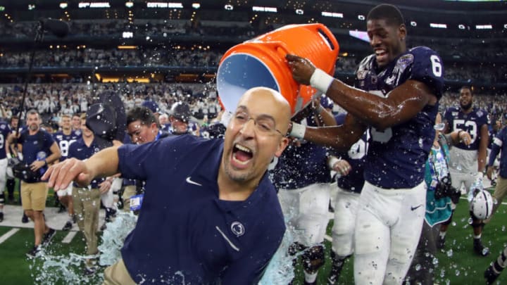 ARLINGTON, TEXAS - DECEMBER 28: Head coach James Franklin of the Penn State Nittany Lions is soaked with the Gatorade cooler by Cam Brown #6 of the Penn State Nittany Lions after the Nittany Lions beat the Memphis Tigers 53-39 at AT&T Stadium on December 28, 2019 in Arlington, Texas. (Photo by Tom Pennington/Getty Images)