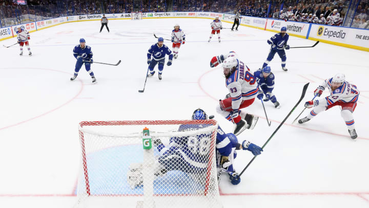 TAMPA, FLORIDA – JUNE 07: Mika Zibanejad #93 of the New York Rangers screens Andrei Vasilevskiy #88 of the Tampa Bay Lightning as a shot comes in Game Four of the Eastern Conference Final during the 2022 Stanley Cup Playoffs at Amalie Arena on June 07, 2022 in Tampa, Florida. (Photo by Bruce Bennett/Getty Images)