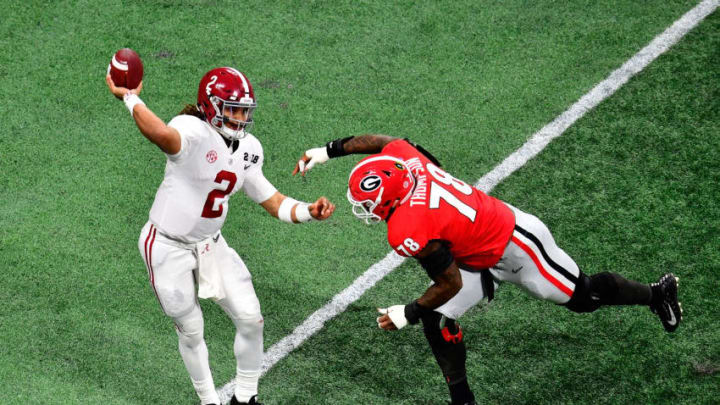 ATLANTA, GA - JANUARY 08: Jalen Hurts #2 of the Alabama Crimson Tide throws a pass under pressure from Trenton Thompson #78 of the Georgia Bulldogs during the second quarter in the CFP National Championship presented by AT&T at Mercedes-Benz Stadium on January 8, 2018 in Atlanta, Georgia. (Photo by Scott Cunningham/Getty Images)