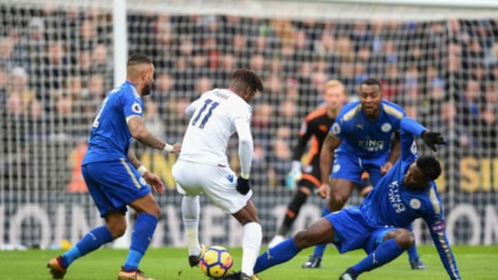 LEICESTER, ENGLAND – DECEMBER 16: Crystal Palace’s Wilfried Zaha is tackled by Leicester City’s Wilfred Ndidi during the Premier League match between Leicester City and Crystal Palace at The King Power Stadium on December 16, 2017 in Leicester, England. (Photo by Jonathan Hobley – Camerasport/CameraSport via Getty Images)