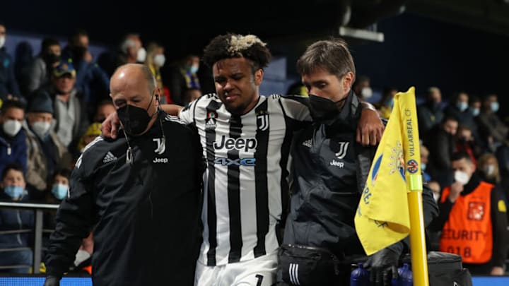 Weston McKennie is assisted from the field of play after an injury on a challenge by Pervis Estupinan during the UEFA Champions League round of 16 match between Villarreal CF and Juventus at Estadio de la Ceramica on February 22, 2022 in Villarreal, Spain. (Photo by Jonathan Moscrop/Getty Images)