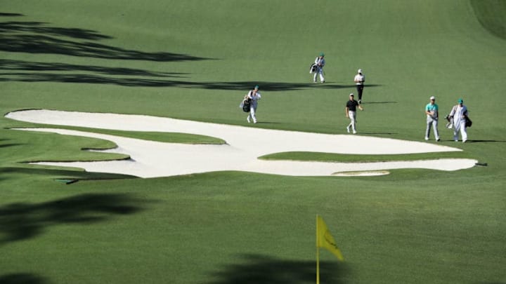 AUGUSTA, GA - APRIL 05: Rory McIlroy of Northern Ireland Jon Rahm of Spain and Adam Scott of Australia walk up the tenth hole plays an approach shot on the tenth hole during the first round of the 2018 Masters Tournament at Augusta National Golf Club on April 5, 2018 in Augusta, Georgia. (Photo by David Cannon/Getty Images)