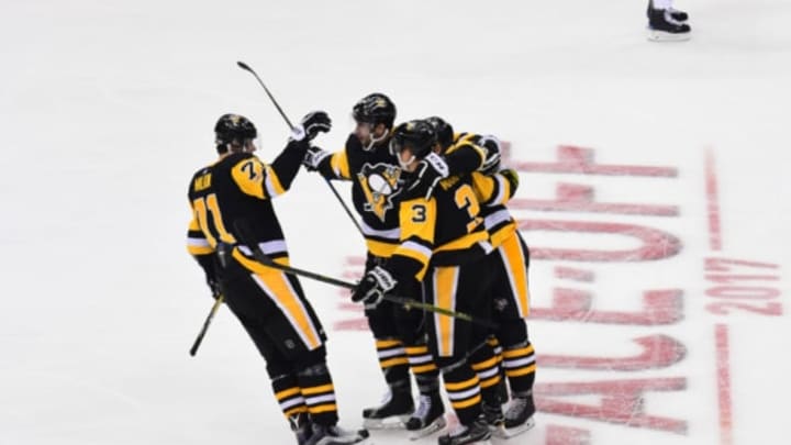 PITTSBURGH, PA - OCTOBER 04: Olli Maatta #3 of the Pittsburgh Penguins is congratulated by teammates after scoring a goal against the St. Louis Blues at PPG PAINTS Arena on October 4, 2017 in Pittsburgh, Pennsylvania. (Photo by Matt Kincaid/Getty Images)