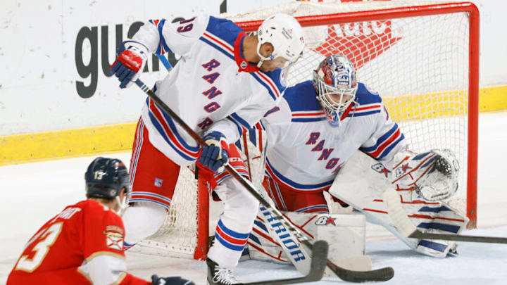 SUNRISE, FL - DECEMBER 29: K'Andre Miller #79 assists Goaltender Igor Shesterkin #31 of the New York Rangers defends the shot by Sam Reinhart #13 of the Florida Panthers during first period action at the FLA Live Arena on December 29, 2021 in Sunrise, Florida. (Photo by Joel Auerbach/Getty Images)