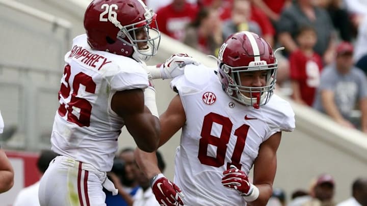 Apr 16, 2016; Tuscaloosa, AL, USA; Alabama Crimson Tide defensive back Marlon Humphrey (26) celebrates with Alabama Crimson Tide wide receiver Derek Kief (81) after Kief scored a touchdown at Bryant-Denny Stadium. Mandatory Credit: Marvin Gentry-USA TODAY Sports