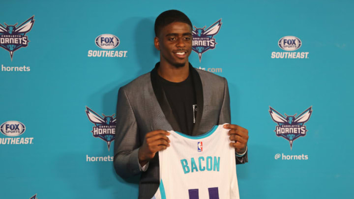 CHARLOTTE, NC - JUNE 23: Rich Cho, General Manager of the Charlotte Hornets, introduces Dwayne Bacon and Malik Monk to the media at a press conference in Charlotte, North Carolina on June 23, 2017 at the Spectrum Center. NOTE TO USER: User expressly acknowledges and agrees that, by downloading and or using this photograph, User is consenting to the terms and conditions of the Getty Images License Agreement. Mandatory Copyright Notice: Copyright 2017 NBAE (Photo by Brock Williams-Smith/NBAE via Getty Images)