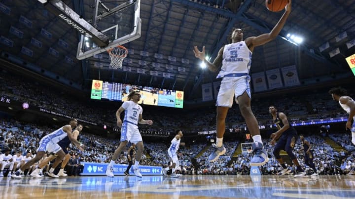 CHAPEL HILL, NORTH CAROLINA - NOVEMBER 06: Armando Bacot #5 of the North Carolina Tar Heels pulls down a rebound against the Notre Dame Fighting Irish during the first half at the Dean Smith Center on November 06, 2019 in Chapel Hill, North Carolina. (Photo by Grant Halverson/Getty Images)