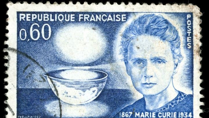 A postage stamp featuring Marie Curie's likeness from France.