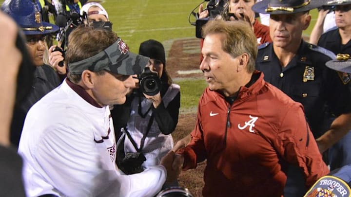 Nov 14, 2015; Starkville, MS, USA; Mississippi State Bulldogs head coach Dan Mullen and Alabama Crimson Tide head coach Nick Saban shake hands after the game at Davis Wade Stadium. Alabama won 31-6. Mandatory Credit: Matt Bush-USA TODAY Sports