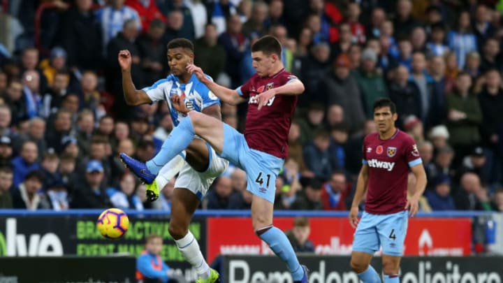 HUDDERSFIELD, ENGLAND - NOVEMBER 10: Steve Mounie of Huddersfield Town battles for possession with Declan Rice of West Ham United during the Premier League match between Huddersfield Town and West Ham United at the John Smith's Stadium on November 10, 2018 in Huddersfield, United Kingdom. (Photo by Nigel Roddis/Getty Images)