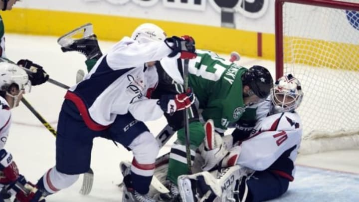 Feb 13, 2016; Dallas, TX, USA; Dallas Stars right wing Ales Hemsky (83) crashes into Washington Capitals goalie Braden Holtby (70) during the second period at the American Airlines Center. Mandatory Credit: Jerome Miron-USA TODAY Sports