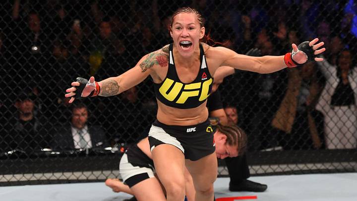 CURITIBA, BRAZIL - MAY 14: (L-R) Cristiane 'Cyborg' Justino of Brazil celebrates after defeating Leslie Smith in their women's catchweight bout during the UFC 198 event at Arena da Baixada stadium on May 14, 2016 in Curitiba, Parana, Brazil. (Photo by Josh Hedges/Zuffa LLC/Zuffa LLC via Getty Images)