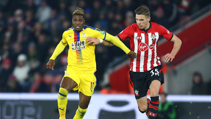 SOUTHAMPTON, ENGLAND - JANUARY 30: Wilfried Zaha of Crystal Palace holds off Jan Bednarek of Southampton during the Premier League match between Southampton FC and Crystal Palace at St Mary's Stadium on January 30, 2019 in Southampton, United Kingdom. (Photo by Jordan Mansfield/Getty Images)
