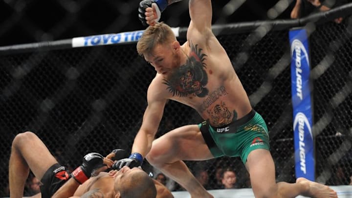 December 12, 2015; Las Vegas, NV, USA; Conor McGregor lands punches to win via technical knockout against Jose Aldo during UFC 194 at MGM Grand Garden Arena. Mandatory Credit: Gary A. Vasquez-USA TODAY Sports
