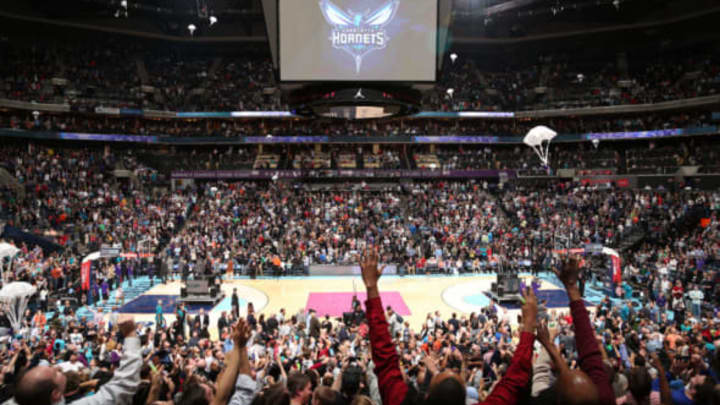 CHARLOTTE, NC – DECEMBER 21: Michael Jordan, Owner of the Charlotte Bobcats unveils the new Charlotte Hornets logo during the game against the Utah Jazz at the Time Warner Cable Arena on December 21, 2013 in Charlotte, North Carolina. NOTE TO USER: User expressly acknowledges and agrees that, by downloading and or using this photograph, User is consenting to the terms and conditions of the Getty Images License Agreement. Mandatory Copyright Notice: Copyright 2013 NBAE (Photo by Brock Williams-Smith/NBAE via Getty Images)