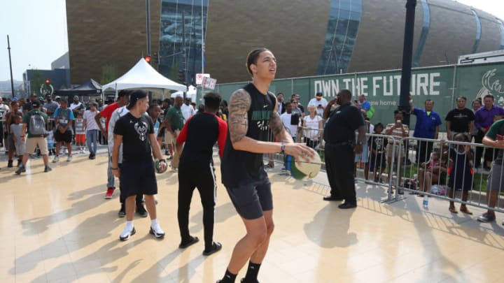 MILWAUKEE, WI - AUGUST 26: D.J. Wilson #5 of the Milwaukee Bucks shoots the ball at a clinic during an open house and block party in honor of the opening of Fiserv Forum on August 26, 2018 in Milwaukee, Wisconsin. NOTE TO USER: User expressly acknowledges and agrees that, by downloading and or using this Photograph, user is consenting to the terms and conditions of the Getty Images License Agreement. Mandatory Copyright Notice: Copyright 2018 NBAE (Photo by Gary Dineen/NBAE via Getty Images)