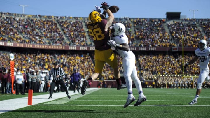 MINNEAPOLIS, MN - OCTOBER 11: Godwin Igwebuike #16 of the Northwestern Wildcats blocks a pass intended for Maxx Williams #88 of the Minnesota Golden Gophers during the game on October 11, 2014 at TCF Bank Stadium in Minneapolis, Minnesota. (Photo by Hannah Foslien/Getty Images)