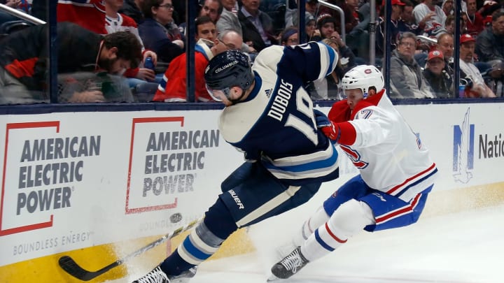 COLUMBUS, OH – NOVEMBER 19: Pierre-Luc Dubois #18 of the Columbus Blue Jackets and Brett Kulak #17 of the Montreal Canadiens battle for control of the puck during the second period on November 19, 2019 at Nationwide Arena in Columbus, Ohio. (Photo by Kirk Irwin/Getty Images)