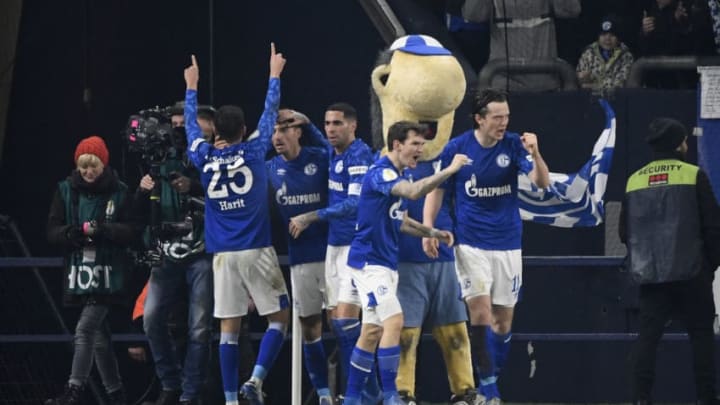 Schalke’s players celebrate scoring during the German Cup (DFB Pokal) round of 16 football match Schalke 04 v Hertha Berlin in Gelsenkirchen, westen Germany on February 4, 2020. (Photo by INA FASSBENDER / AFP) / DFB REGULATIONS PROHIBIT ANY USE OF PHOTOGRAPHS AS IMAGE SEQUENCES AND QUASI-VIDEO. (Photo by INA FASSBENDER/AFP via Getty Images)