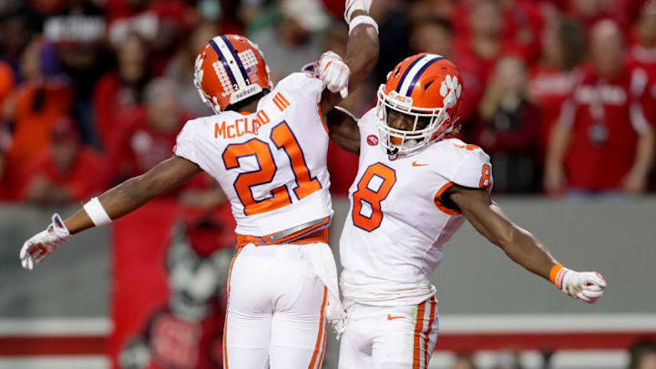 RALEIGH, NC - NOVEMBER 04: Deon Cain #8 celebrates after scoring a touchdown with teammate Ray-Ray McCloud #21 of the Clemson Tigers during their game against the North Carolina State Wolfpack at Carter Finley Stadium on November 4, 2017 in Raleigh, North Carolina. (Photo by Streeter Lecka/Getty Images)