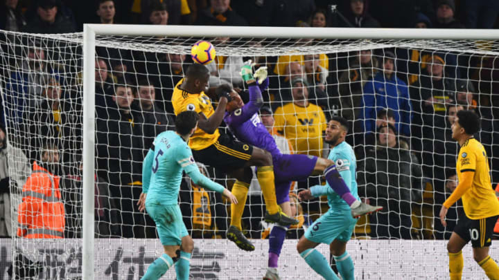 WOLVERHAMPTON, ENGLAND - FEBRUARY 11: Willy Boly of Wolverhampton Wanderers outjumps goalkeeper Martin Dubravka of Newcastle United as he scores his team's first goal during the Premier League match between Wolverhampton Wanderers and Newcastle United at Molineux on February 11, 2019 in Wolverhampton, United Kingdom. (Photo by Stu Forster/Getty Images)
