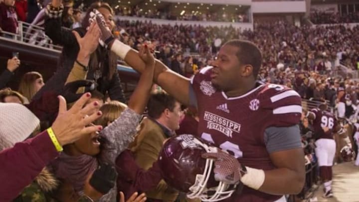Nov 1, 2014; Starkville, MS, USA; Mississippi State Bulldogs defensive lineman Chris Jones (96) celebrates with the fans during the game against the Arkansas Razorbacks at Davis Wade Stadium. The Bulldogs defeat the Razorbacks 17-10. Mandatory Credit: Marvin Gentry-USA TODAY Sports Nov 1, 2014; Starkville, MS, USA; Mississippi State Bulldogs defensive lineman Chris Jones (96) celebrates with the fans during the game against the Arkansas Razorbacks at Davis Wade Stadium. The Bulldogs defeat the Razorbacks 17-10. Mandatory Credit: Marvin Gentry-USA TODAY Sports