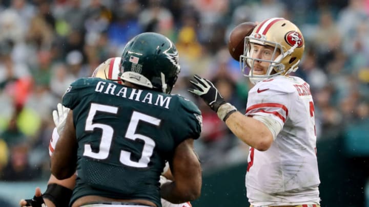 PHILADELPHIA, PA - OCTOBER 29: C.J. Beathard #3 of the San Francisco 49ers passes under pressure from Brandon Graham #55 of the Philadelphia Eagles in the second half on October 29, 2017 at Lincoln Financial Field in Philadelphia, Pennsylvania. (Photo by Elsa/Getty Images)