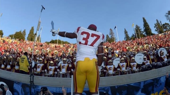 Nov 9, 2013; Berkeley, CA, USA; Southern California Trojans tailback Javorius Allen (37) conducts the Spirit of Troy marching band after the game against the California Golden Bears at Memorial Stadium. USC defeated California 62-28. Mandatory Credit: Kirby Lee-USA TODAY Sports