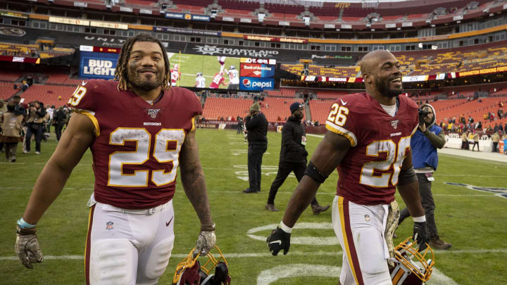 LANDOVER, MD – NOVEMBER 17: Derrius Guice #29 and Adrian Peterson #26 of the Washington Redskins leave the field after the game against the New York Jets at FedExField on November 17, 2019 in Landover, Maryland. (Photo by Scott Taetsch/Getty Images)