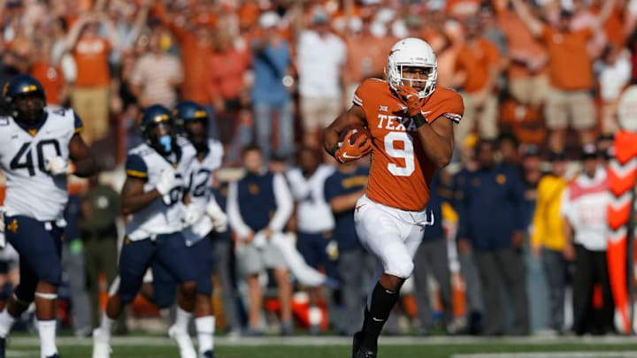 AUSTIN, TX - NOVEMBER 03: Collin Johnson #9 of the Texas Longhorns runs for a touchdown which was called back due to a penalty in the second quarter against the West Virginia Mountaineers at Darrell K Royal-Texas Memorial Stadium on November 3, 2018 in Austin, Texas. (Photo by Tim Warner/Getty Images) AUSTIN, TX - NOVEMBER 03: Collin Johnson #9 of the Texas Longhorns runs for a touchdown which was called back due to a penalty in the second quarter against the West Virginia Mountaineers at Darrell K Royal-Texas Memorial Stadium on November 3, 2018 in Austin, Texas. (Photo by Tim Warner/Getty Images)