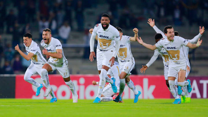 Pumas players react after Juan Dinenno converted the game-winning penalty kick in a shoot-out to complete a srtunning comeback over the New England Revolution. (Photo by Mauricio Salas/Jam Media/Getty Images)