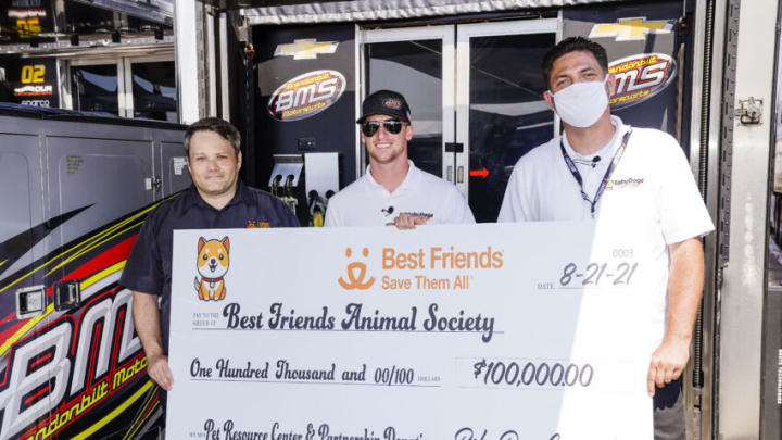 (PHOTO: Courtesy) Jon Dunn of Best Friends Animal Society, Brandon Brown, and Mike Watkins of Baby Doge with a donation presented to Best Friends for $100,000. Baby Doge also created a wallet for Best Friends to start accepting cryptocurrency for the first time ever as part of its mission to help dogs in need.