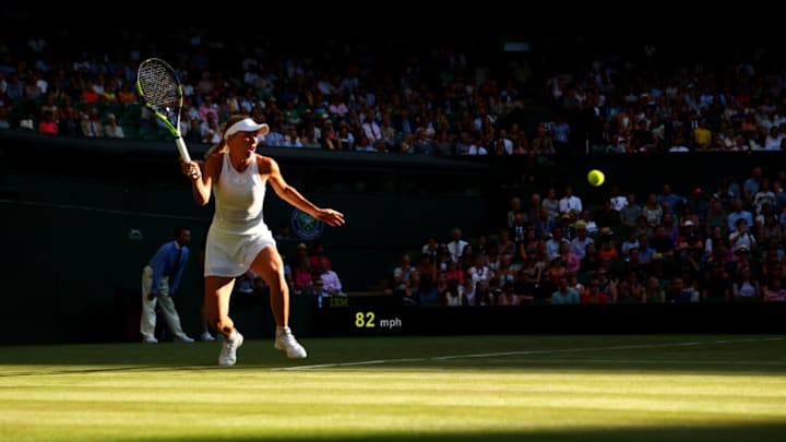LONDON, ENGLAND - JULY 04: Caroline Wozniacki of Denmark plays a forehand during the Ladies Singles first round match against Timea Babos of Hungary on day two of the Wimbledon Lawn Tennis Championships at the All England Lawn Tennis and Croquet Club on July 4, 2017 in London, England. (Photo by Michael Steele/Getty Images)