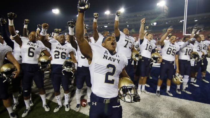 Nov 26, 2016; Dallas, TX, USA; Navy running back Toneo Gulley (2) leads the cheer following the Midshipmen