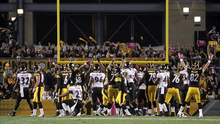 Oct 20, 2013; Pittsburgh, PA, USA; The Pittsburgh Steelers celebrate the game-winning field goal by kicker Shuan Suisham (6) against the Baltimore Ravens during the second half at Heinz Field. The Steelers won the game, 19-16. Mandatory Credit: Jason Bridge-USA TODAY Sports