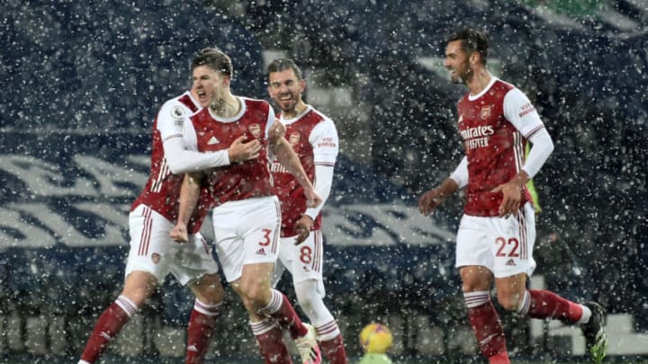WEST BROMWICH, ENGLAND - JANUARY 02: Kieran Tierney of Arsenal celebrates with teammates Rob Holding, Dani Ceballos and Pablo Mari after scoring their team's first goal during the Premier League match between West Bromwich Albion and Arsenal at The Hawthorns on January 02, 2021 in West Bromwich, England. The match will be played without fans, behind closed doors as a Covid-19 precaution. (Photo by Rui Vieira - Pool/Getty Images)