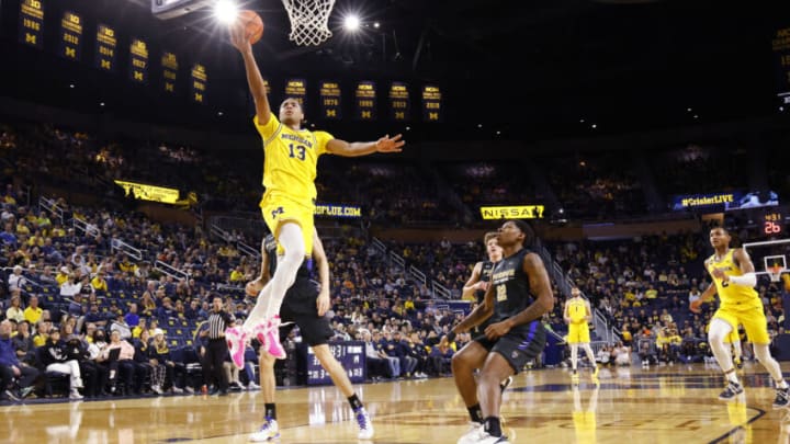 Nov 7, 2022; Ann Arbor, Michigan, USA; Michigan Wolverines guard Jett Howard (13) shoots on IPFW Mastodons guard Anthony Roberts (22) in the first half at Crisler Center. Mandatory Credit: Rick Osentoski-USA TODAY Sports