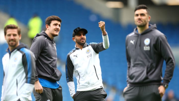 BRIGHTON, ENGLAND - MARCH 31: Harry Maguire of Leicester City talks to Riyad Mahrez of Leicester City during the Premier League match between Brighton and Hove Albion and Leicester City at Amex Stadium on March 31, 2018 in Brighton, England. (Photo by Steve Bardens/Getty Images)